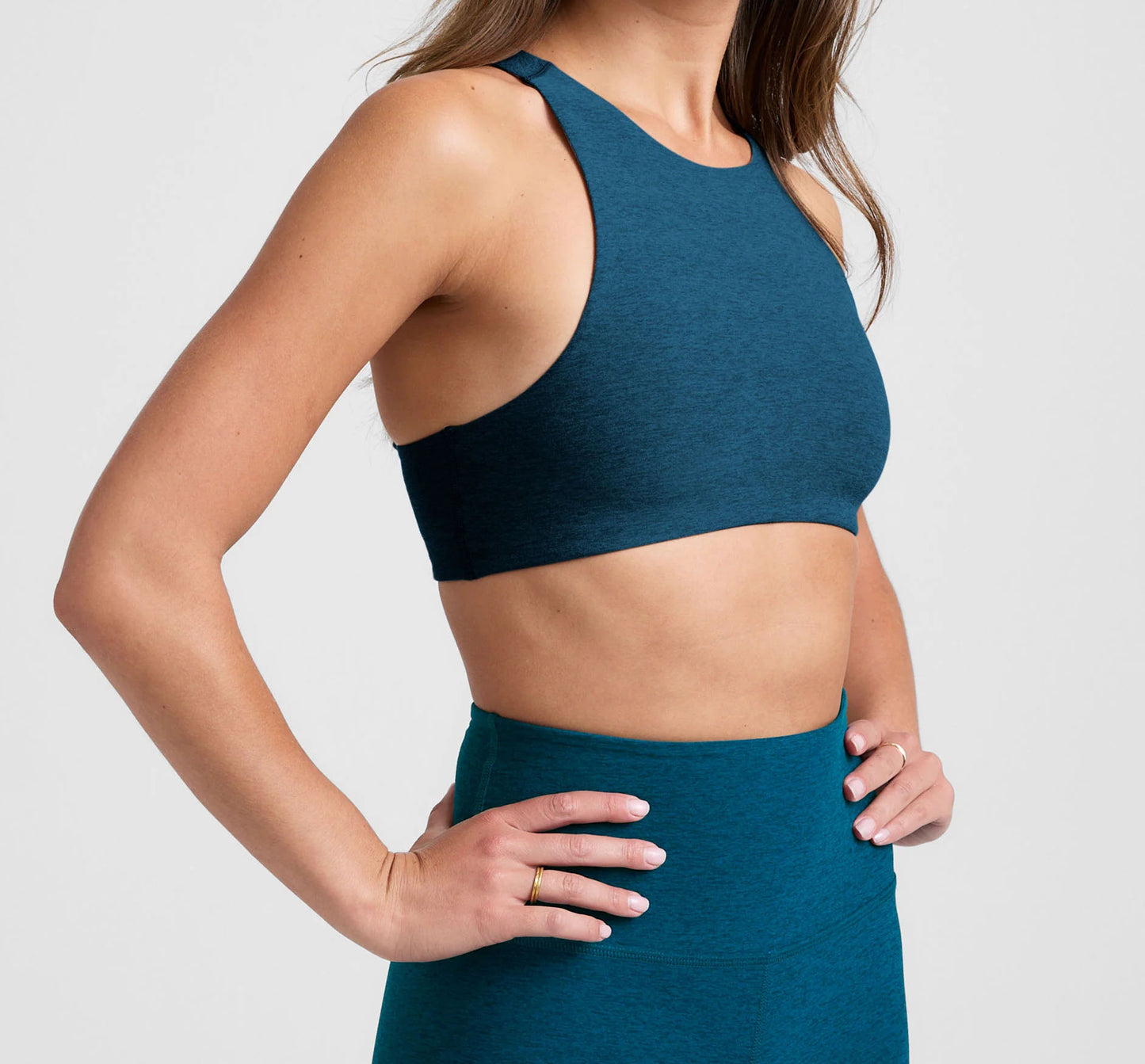 Teal sleeveless crop top and high-waist leggings set