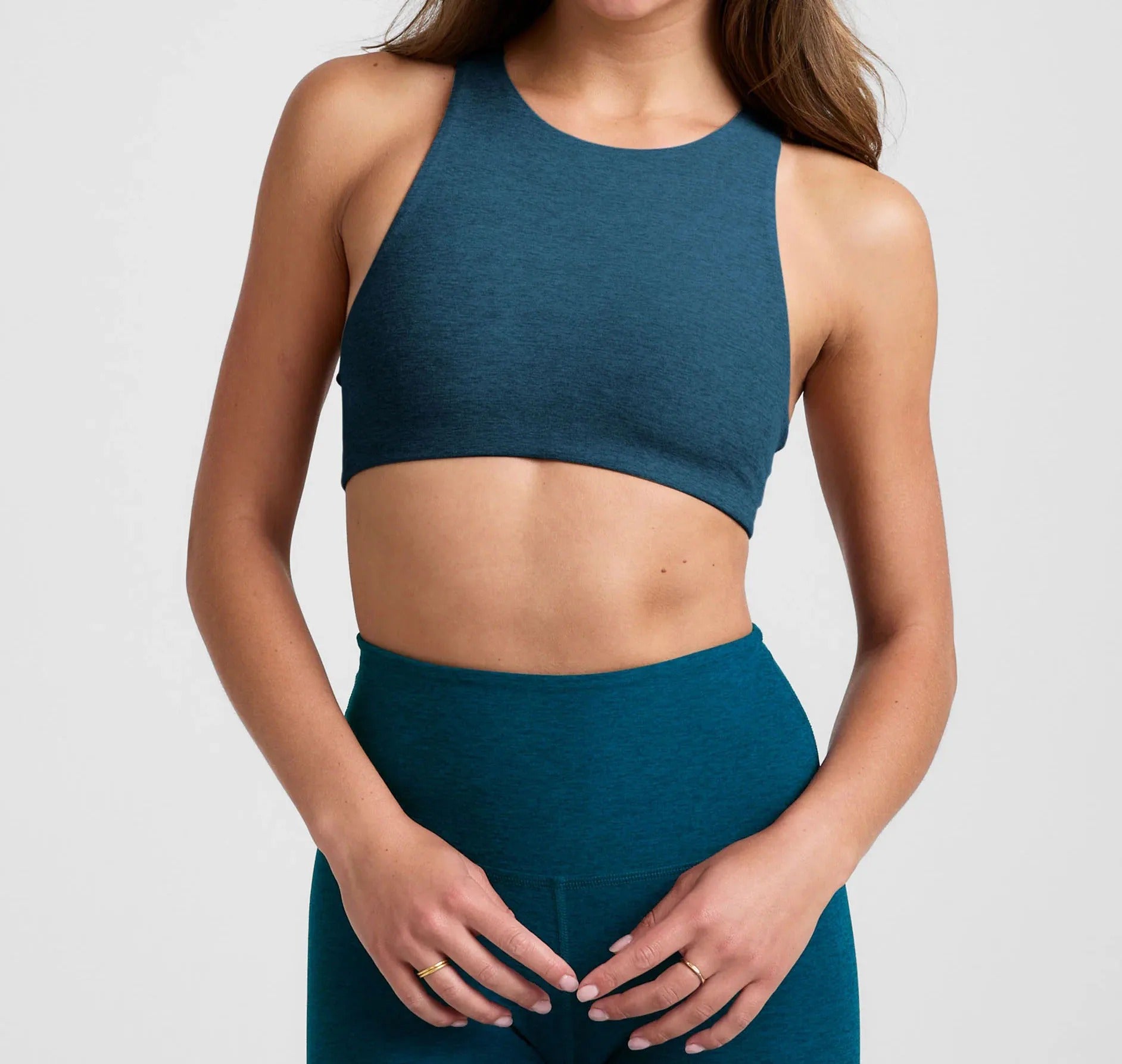 Teal sleeveless crop top and high-waist leggings set