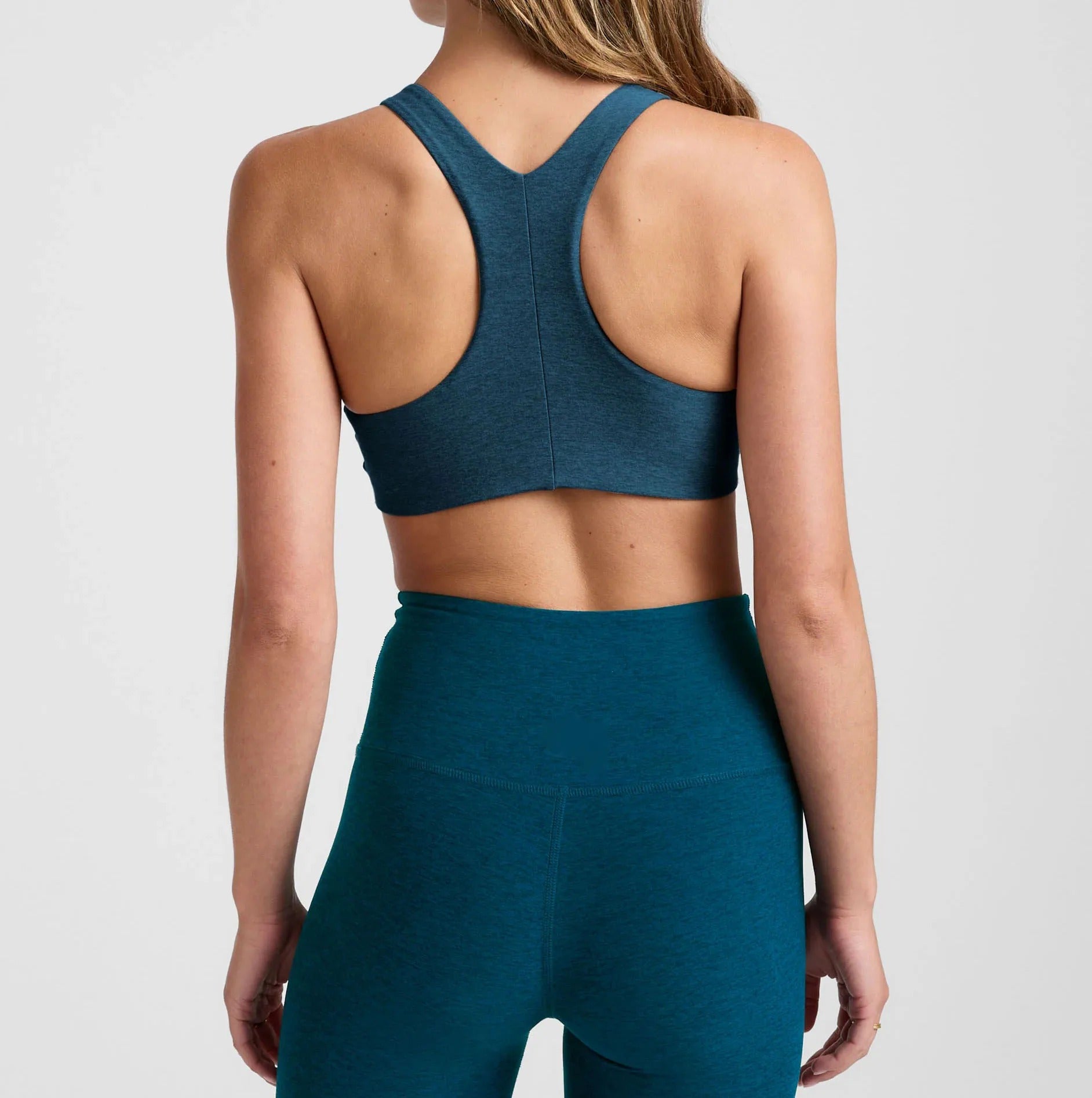 Teal sleeveless crop top and high-waist leggings set