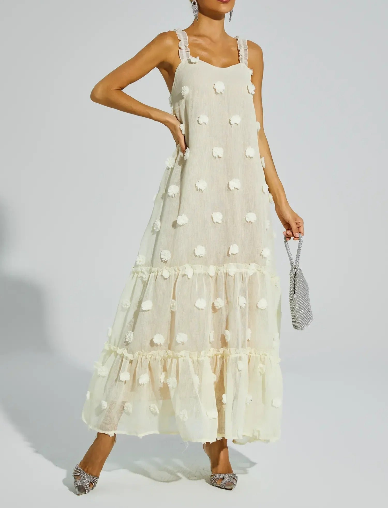 Cream sleeveless midi dress with textured dot pattern